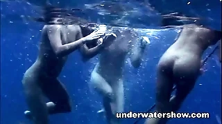Three girls swimming nude there deeply
